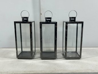 A Trio Of Large Black Metal Lanterns