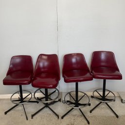 A Set Of Four Vintage Red Bar Stools