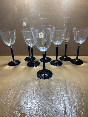 Set Of 8 Sasaki Crystal Flutes, Glasses, And Goblet Cups With Black And Gold Tone Stems