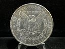 1884 P Morgan Silver Dollar - Almost Uncirculated