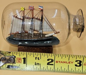 Miniature Ship In A Bottle On Wood Pedestal - (B9)