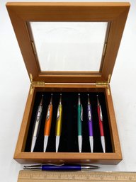 7 Multicolored Pens In Wood Box