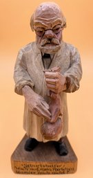German Doctor Spanking Baby With German Text Wood Carving - (DR)