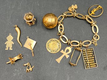 Charm Bracelet W/ Several 14K Gold Charms (J42)