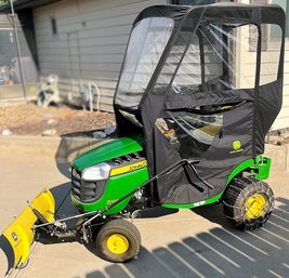 John Deere D105 Lawn Tractor Bundle With Cab Covering, Scrapper Blade, Mowing And Snow Blower Attachments