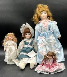 4 Assorted Sized Porcelain Dolls - (B5)