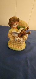 Child With Book Figurine