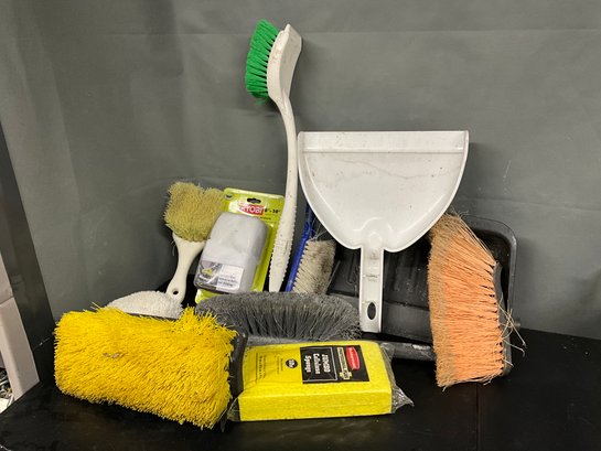 Grouping Of Cleaning Brushes And Dust Pans
