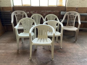 Grouping Of Plastic Patio Chairs