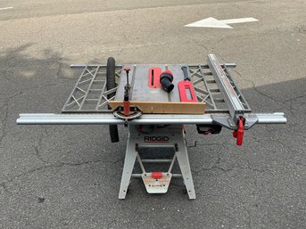 Ridgid 10' Table Saw - Model No. TS24241 On Retractable Wheeled Base With Fence And Accessories.