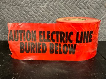 Electric Line Buried Below Red Caution Tape