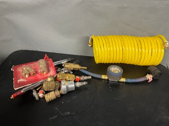 Grouping Of Air Hose Fittings, Yellow Air Hose And Gauge