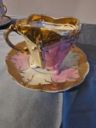 Pink Luster And Footed Teacup And Saucer