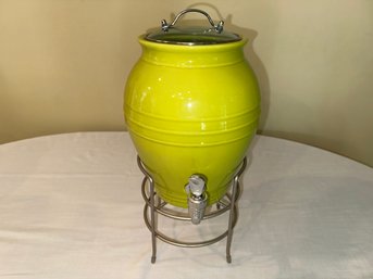 A Ceramic Beverage Server On Stand