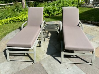 Two Outdoor Lounge Chairs With Cushions And Side Table