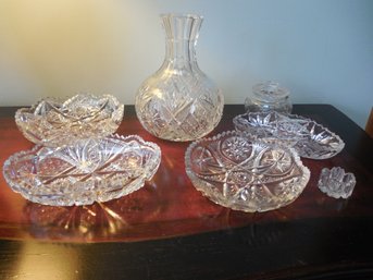 Assorted Lot Of Cut Crystal Plates, Lidded Vessel, And Carafe