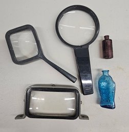 Vintage Magnifying Glasses And Small Glass Bottles