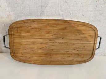 Wooden Charcuterie Board With A Wrapped Metal Edge And Metal Handled