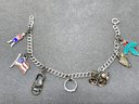 Charm Bracelet With Sterling Charms Including A Sandel, Arrowhead And More