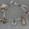 Charm Bracelet With Sterling Charms Including A Sandel, Arrowhead And More