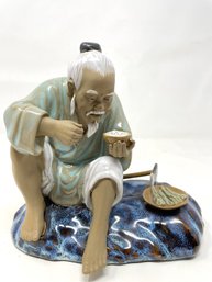 Chinese Mudman Figurine Seated Eating