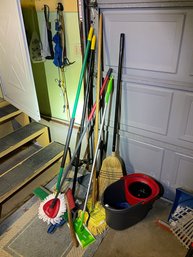 Garage Lot Of Brooms, Mops Etc