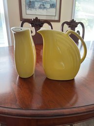 Pair Of Yellow Hall Pitchers