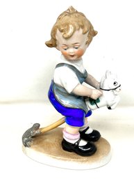 Porcelain Figure Of A Child With Hobby Horse