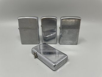 Collection Of Four Zippo Lighters