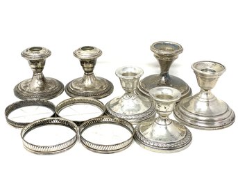 Collection Of Weighted Sterling Candlesticks And Sterling Rimmed Coasters