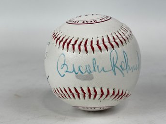 Signed Baseball Featuring Brooks Robinson Sparkly Lyle And More