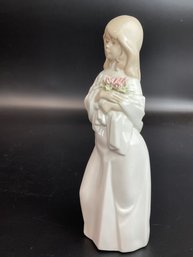 Porcelain Figure Of A Woman Holding Flowers By Nadal