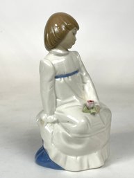 Porcelain Figure Of A Seated Girl With Flowers By Nadal