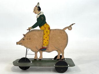 Polychromed Iron Clown Riding A Pig Pull Toy