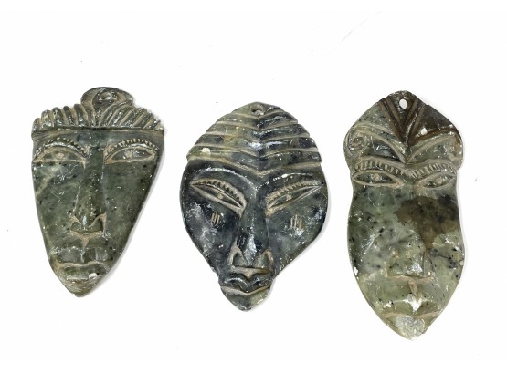 Collection Of Carved Stone Faces Masks