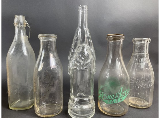 Glass Bottle Collection Including Some Milk Bottles And Crab Wine Bottle
