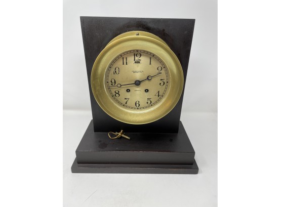 Brass Chelsea Ships Clock Mounted On Panel With Key