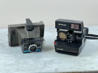 Two Polaroid Cameras