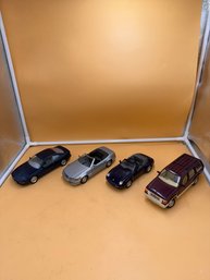 Lot Of 4. 1:24 Scale Diecast Vehicles