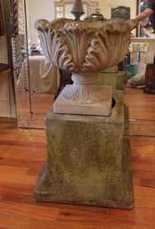 PAIR OF EARLY ENGLISH ACANTHUS LEAF STONE URNS ON STANDS