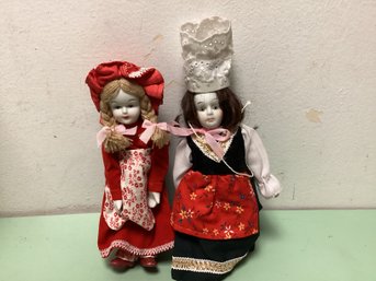 Two White Face Porcelain Dolls