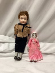 Two Antique Porcelain Dolls - One White Face