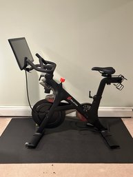 Peloton Bicycle With Rubber Mat