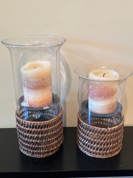 Two Hurricane Candle Holders With Rattan Bottoms