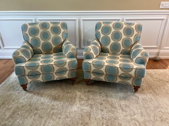 Pair Of Upholstered Arm Chairs On Castors