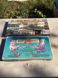 37, TABLE LOT #37, Sealed Board Games (2), Anti-Monopoly, Etc.