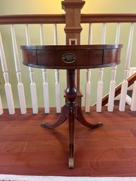 Mahogany 24 Inch Drum Table With Stenciled Leather Top And One Drawer