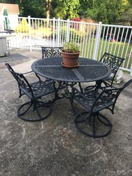 54 Inch Round Cast Aluminum Table With 4 Swivel And Rocking Chairs