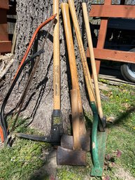 Two Axes, Two Hand Saws, Sledge Hammer, Pick Axe Weed Trimmer In Excellent Condition