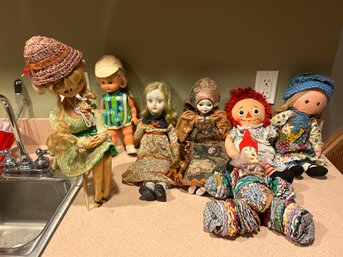 Large Lot Of Vintage Dolls Holly Hobby,raggedy Ann,  Porcelain OrientalBig Eye Sitting Some Condition Issues